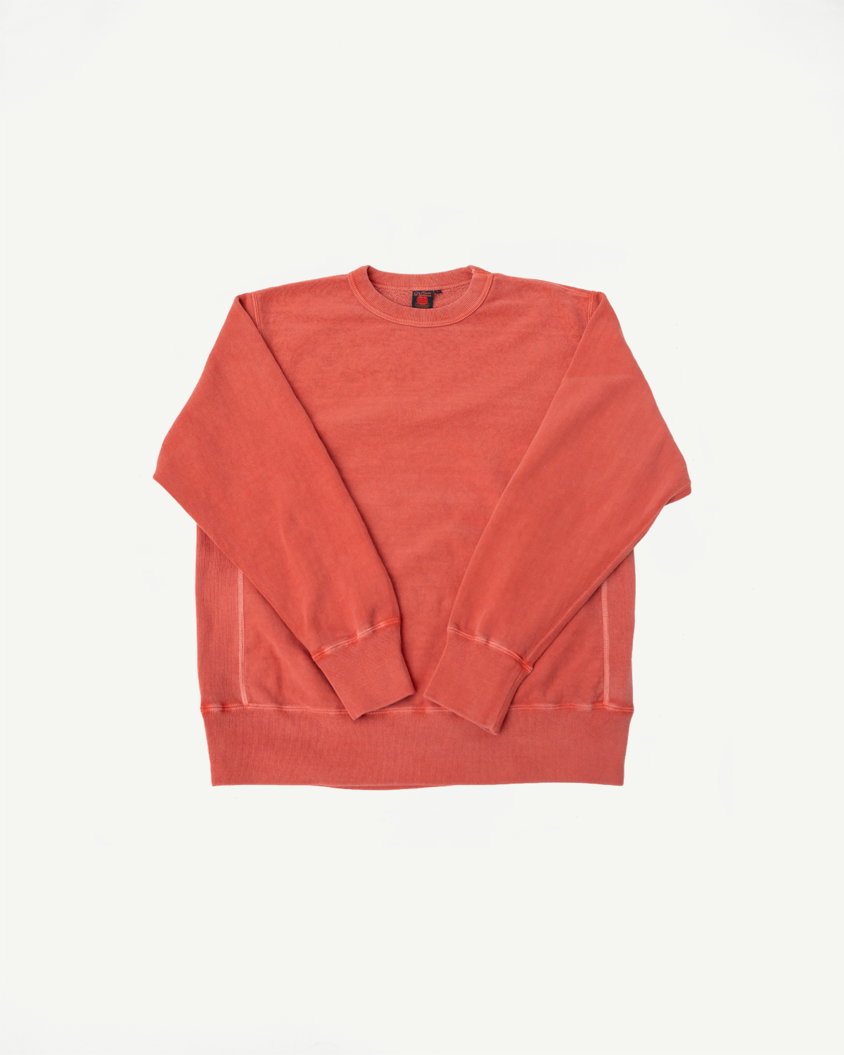 Flat lay front view of red Studio D'Artisan Bengara reverse weave crewneck sweatshirt, ribbed cuffs and hem, Dant casual apparel.
