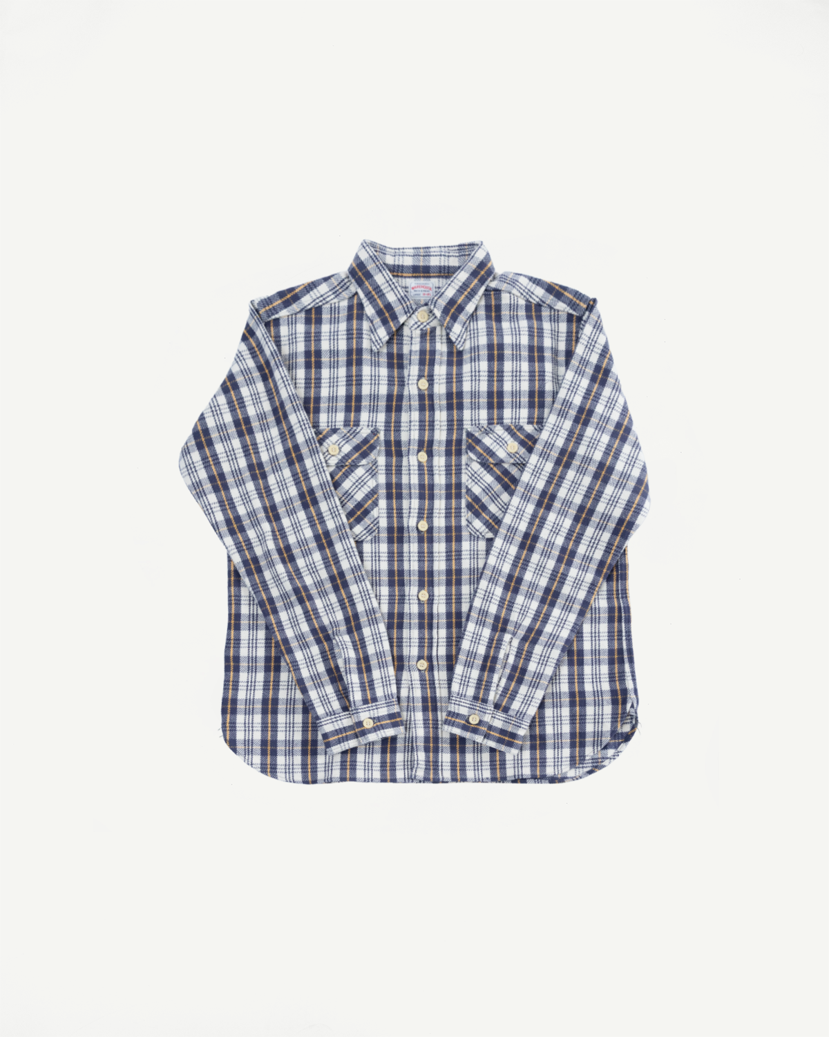Flat lay front view of navy and white plaid flannel shirt with button details and chest pockets