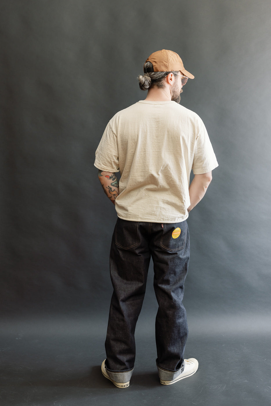 Full body rear view of male model, 5'9
