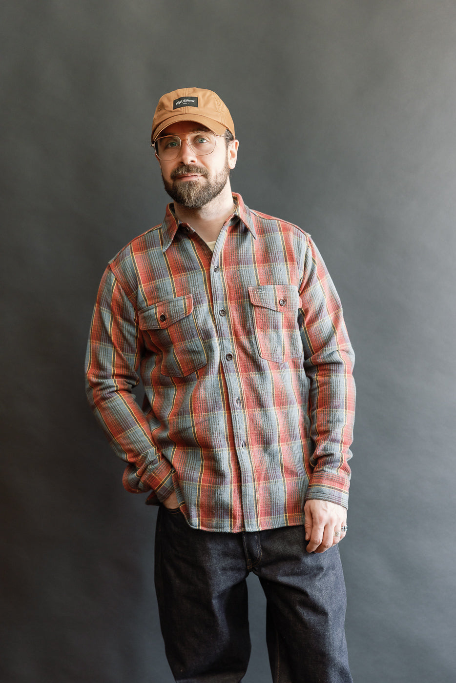 Man wearing the Lot 3022 Flannel Shirt w/ Chinstrap G Pattern - Red, Navy, styled with dark jeans; showcasing the vintage-inspired, brushed flannel texture and classic American workwear design.