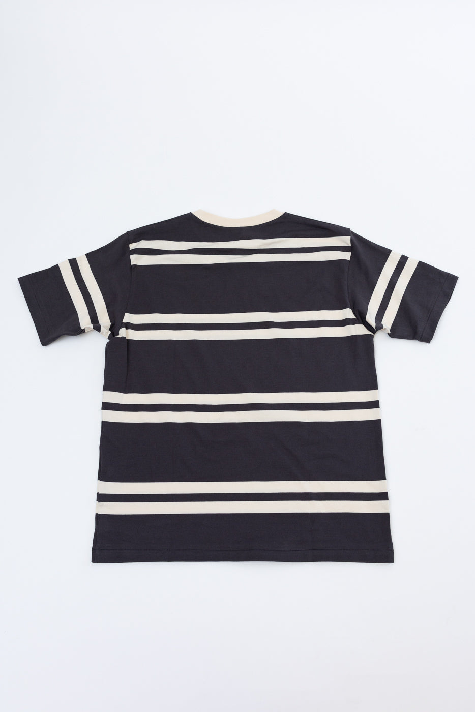 Back view flat lay of navy and cream striped short-sleeve t-shirt with ribbed crew neck and sleeve stripes.