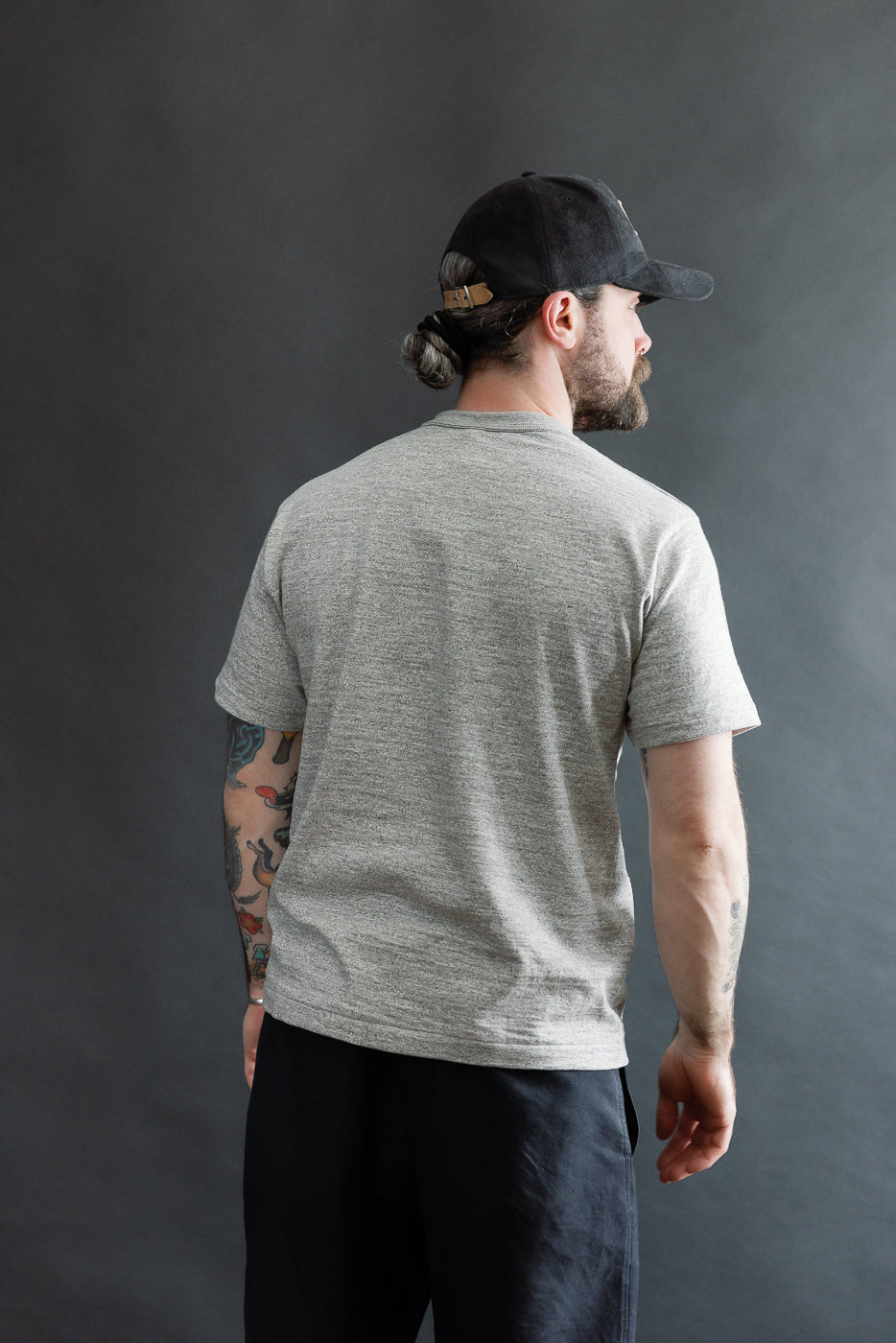 Back view, heather grey slubby cotton t-shirt on male model, 5'9