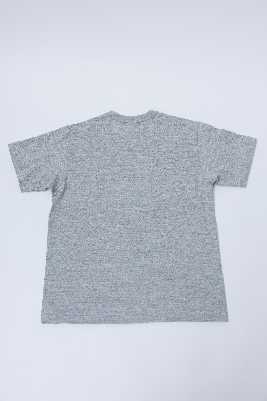 Flat lay of Warehouse & Co. Lot 4601 heather grey t-shirt, back view, showing fabric texture.