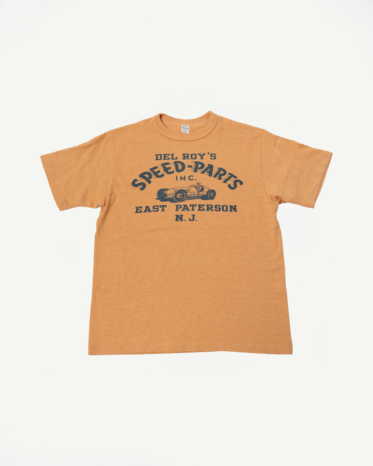 Front flat lay of orange slubby cotton graphic t-shirt, Del Roy's Speed Parts print, short sleeves