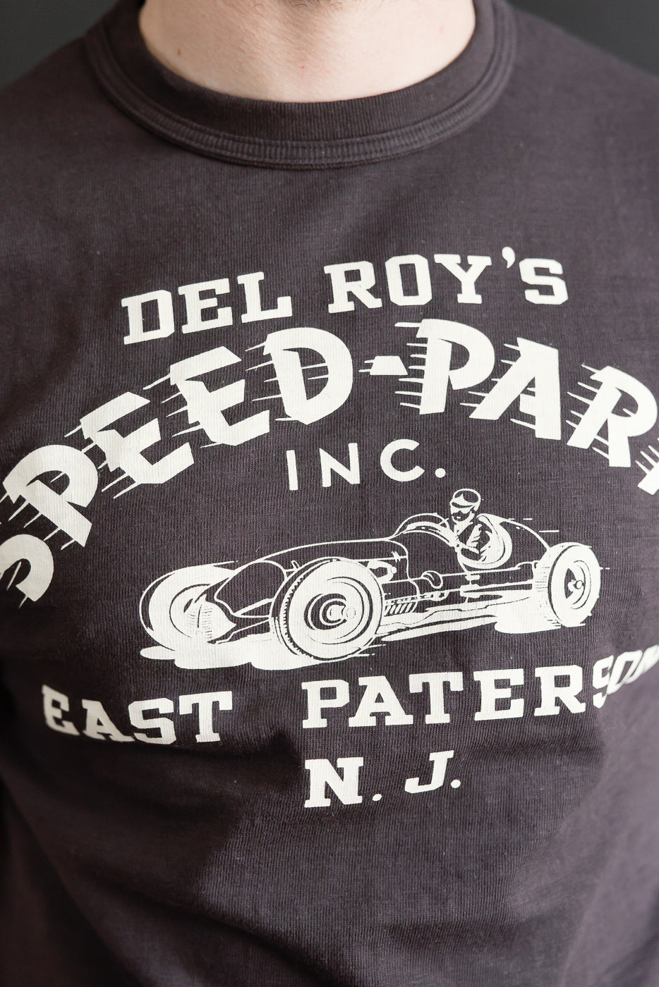 Close-up front of Warehouse & Co. Lot 4601 slubby cotton t-shirt, black, graphic print, on male model 5'9