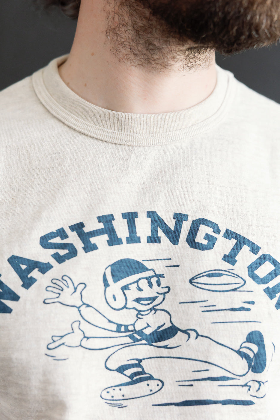 Close-up front view of slubby cotton t-shirt on 5'9