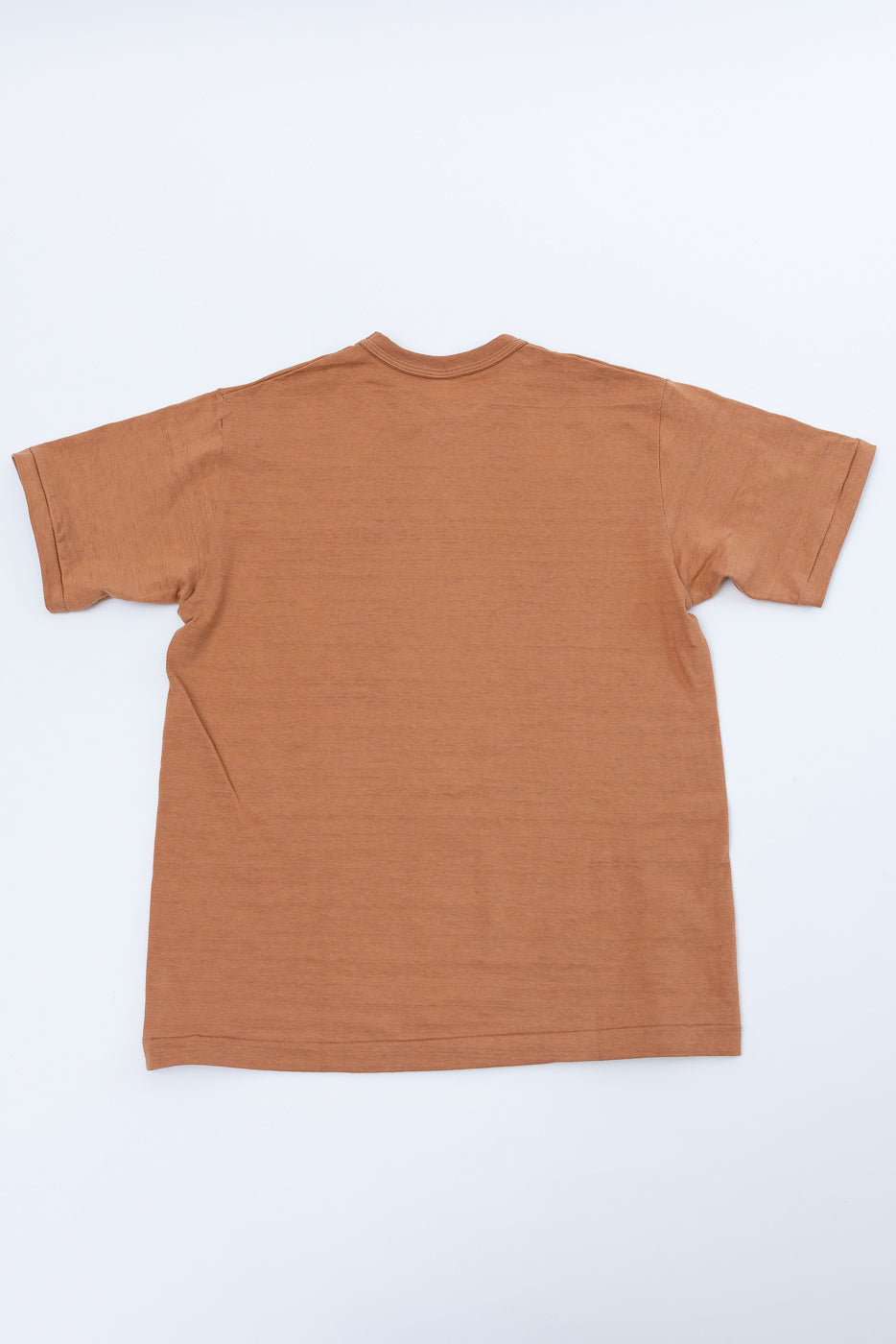 Flat lay, back view of a brown cotton t-shirt showing the collar and shoulder seams.