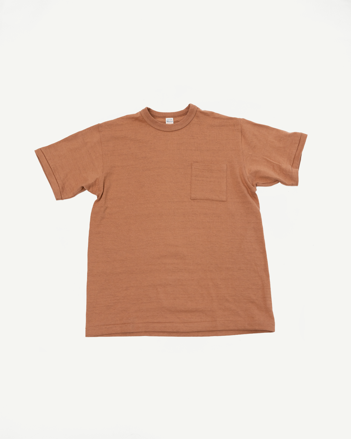 Front view flat lay of a brown textured cotton pocket t-shirt.