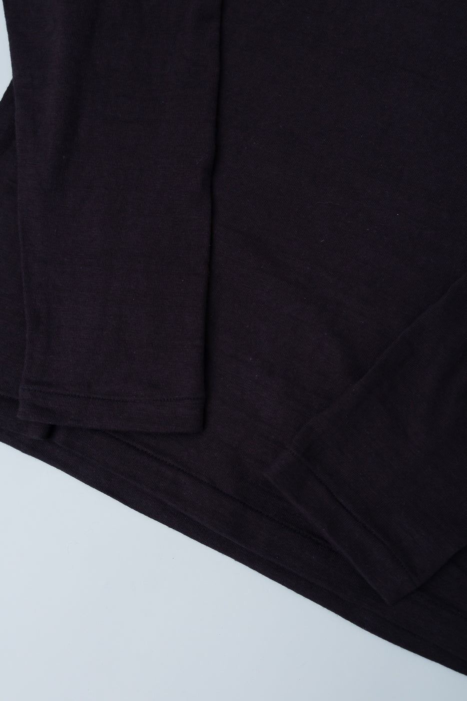 Close-up of Warehouse & Co slubby cotton long sleeve t-shirt sleeve and hem, front side.