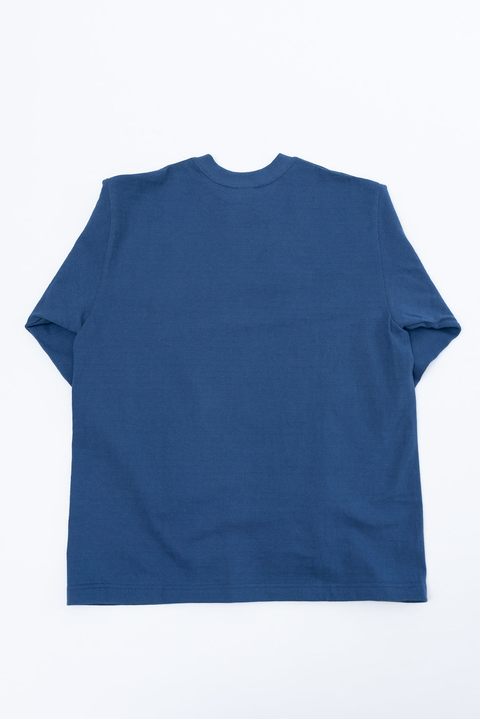 Flat lay, back view of a blue long-sleeve crewneck t-shirt.