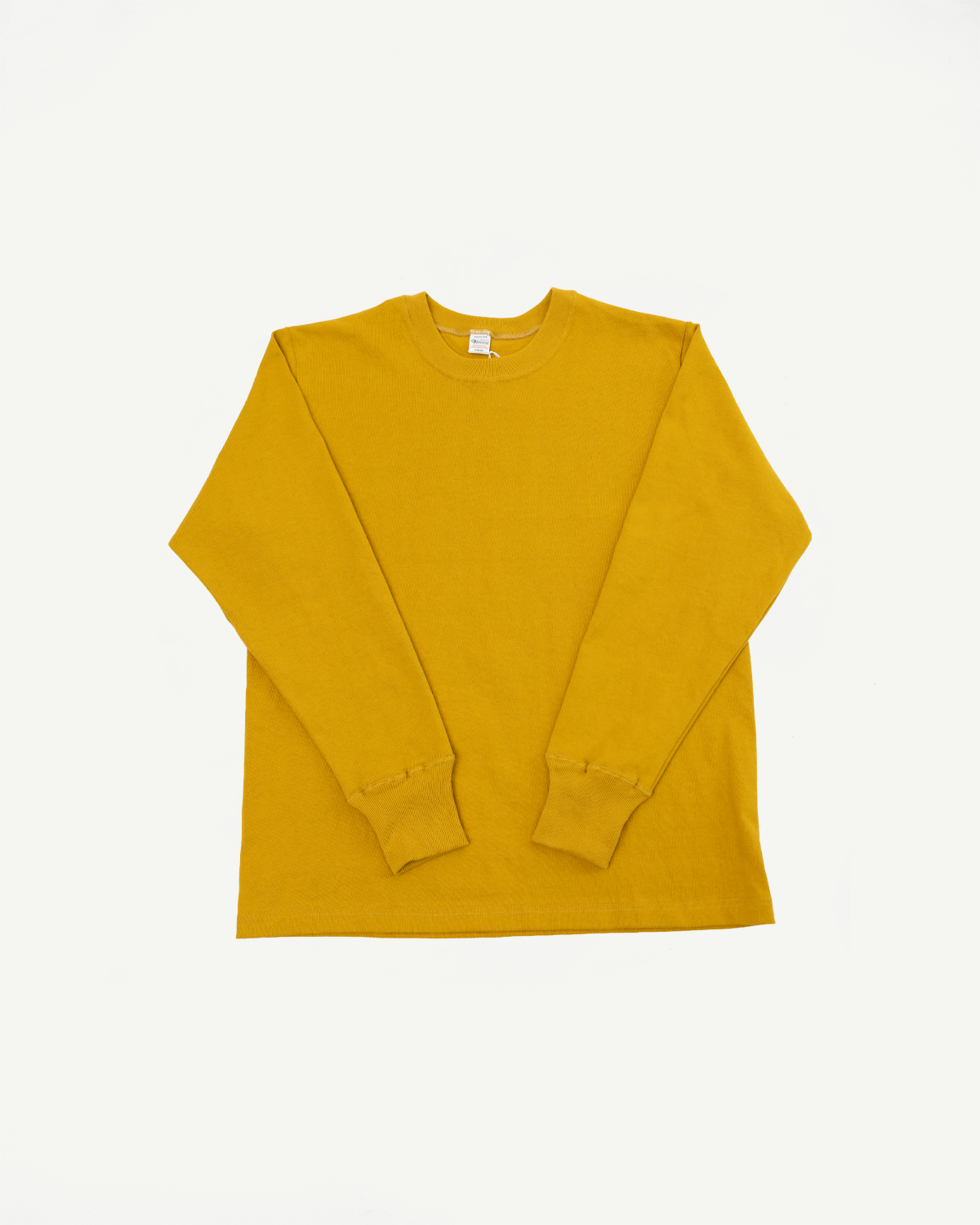 Front view flat lay of a mustard yellow long-sleeve crewneck t-shirt.