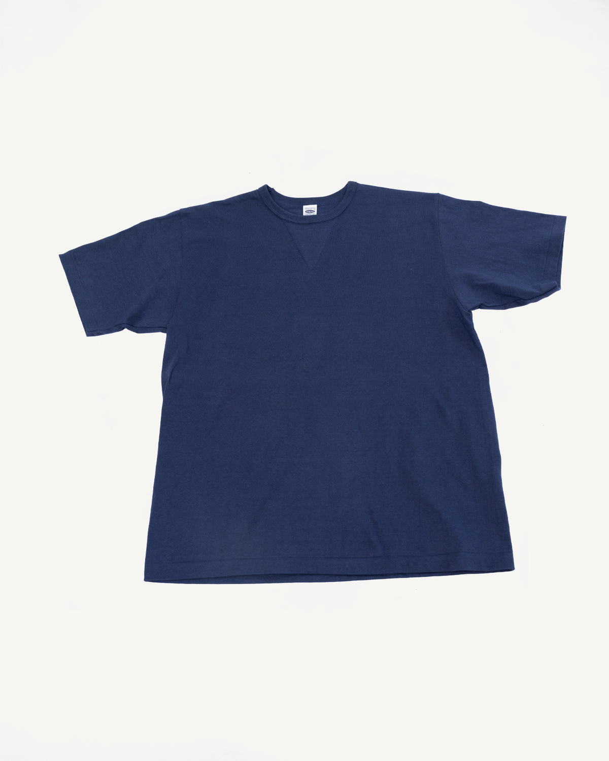 Front view flat lay of a navy blue short-sleeve t-shirt with a v-neck collar.
