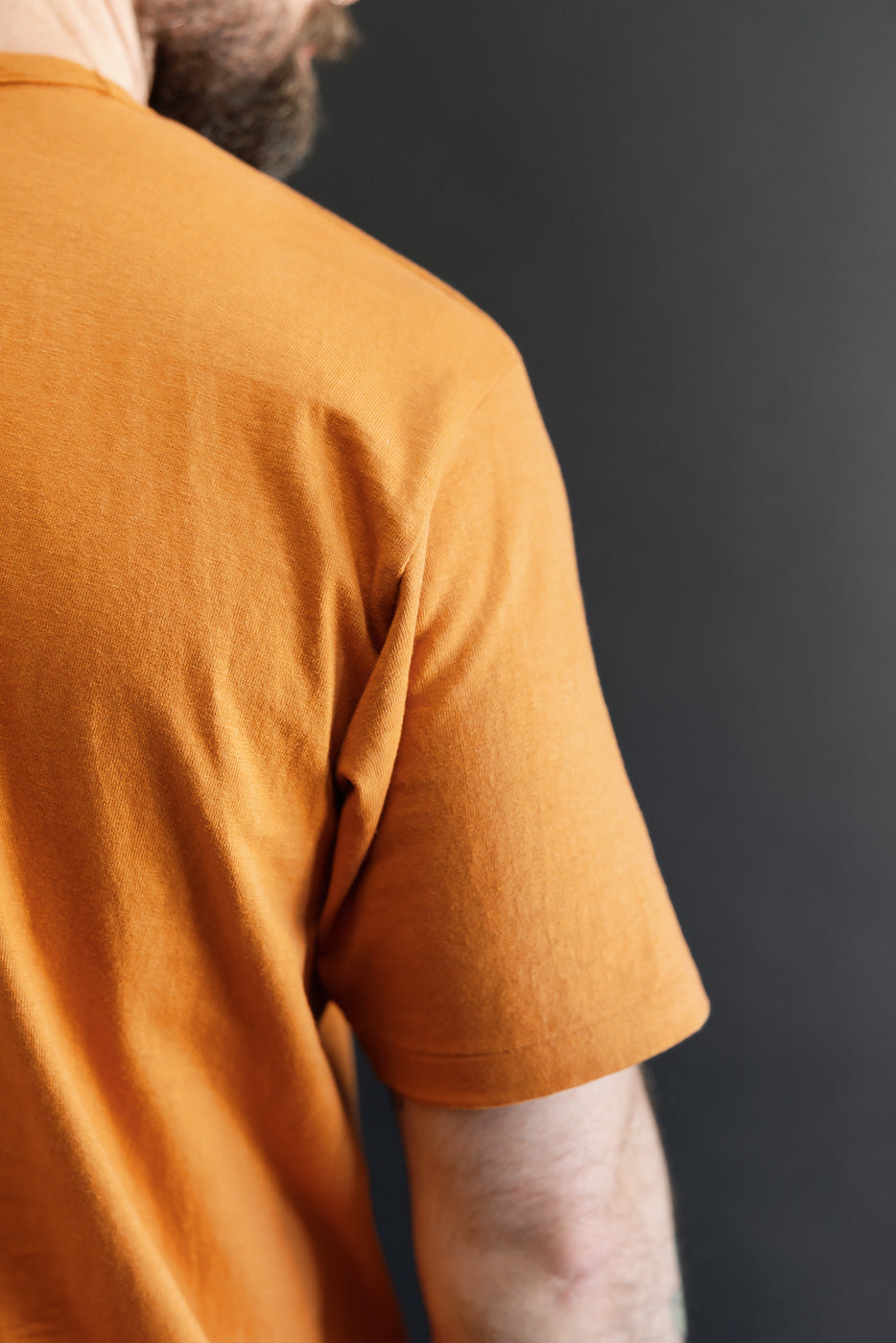 Close-up side view of a male model (5'9