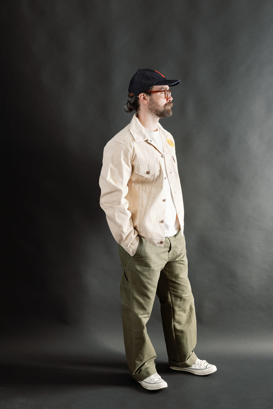 Male model 5'9 165lbs athletic build wearing ecru denim jacket, side view full body, Dant casual apparel