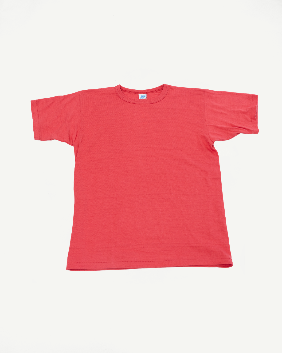 Flat lay of the front of a red short-sleeved t-shirt with a crew neck collar.