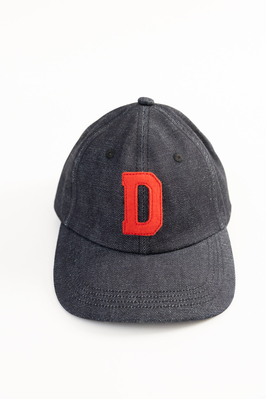 Front view close-up of Warehouse Lot 303 Strong Denime baseball cap in dark indigo, red D patch.