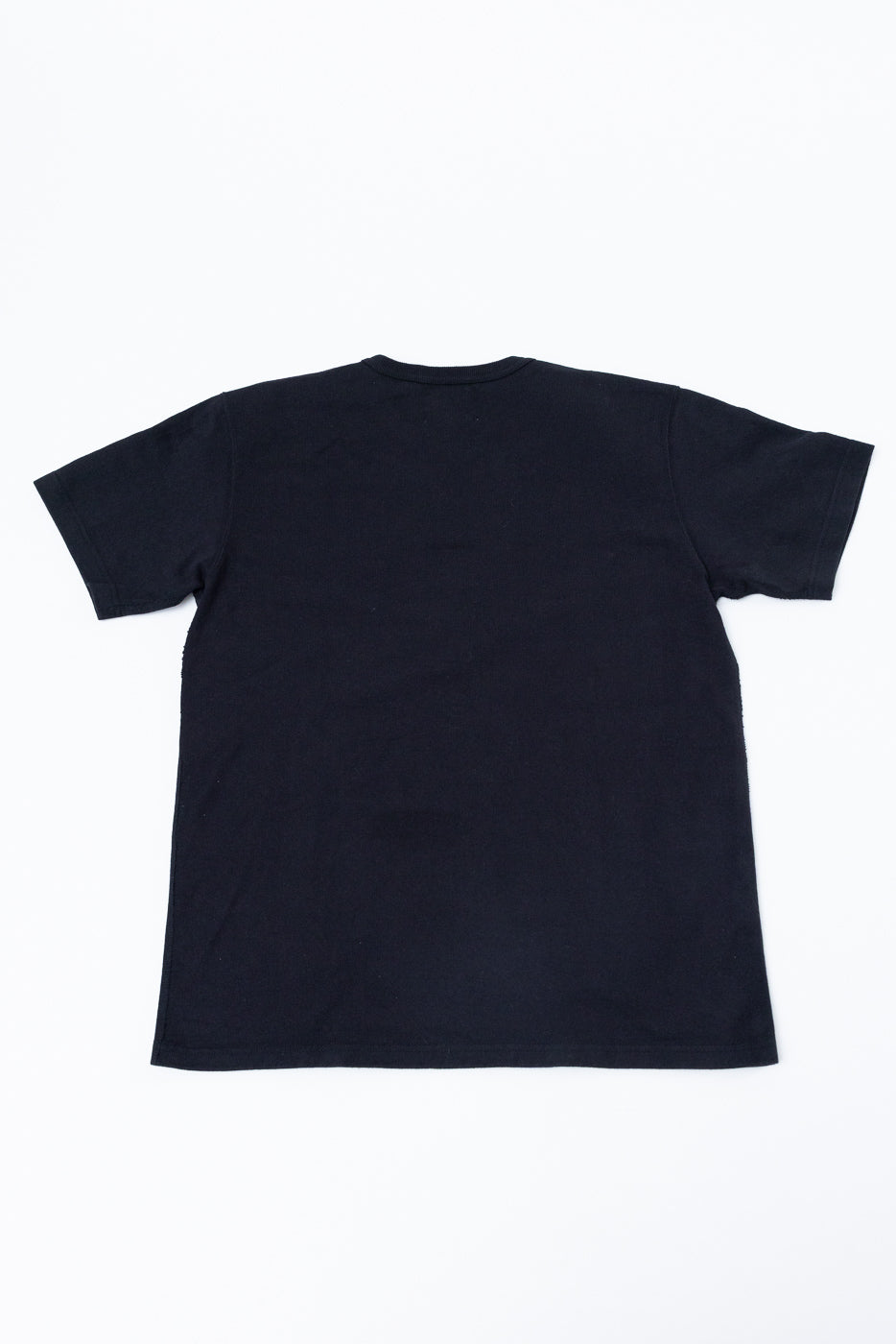 Back view flat lay of a plain black short-sleeve t-shirt.
