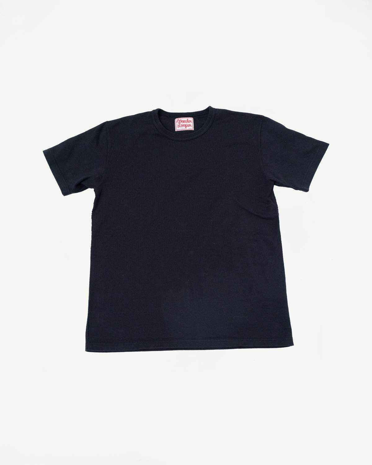 Front view flat lay of a navy blue ribbed crewneck t-shirt.