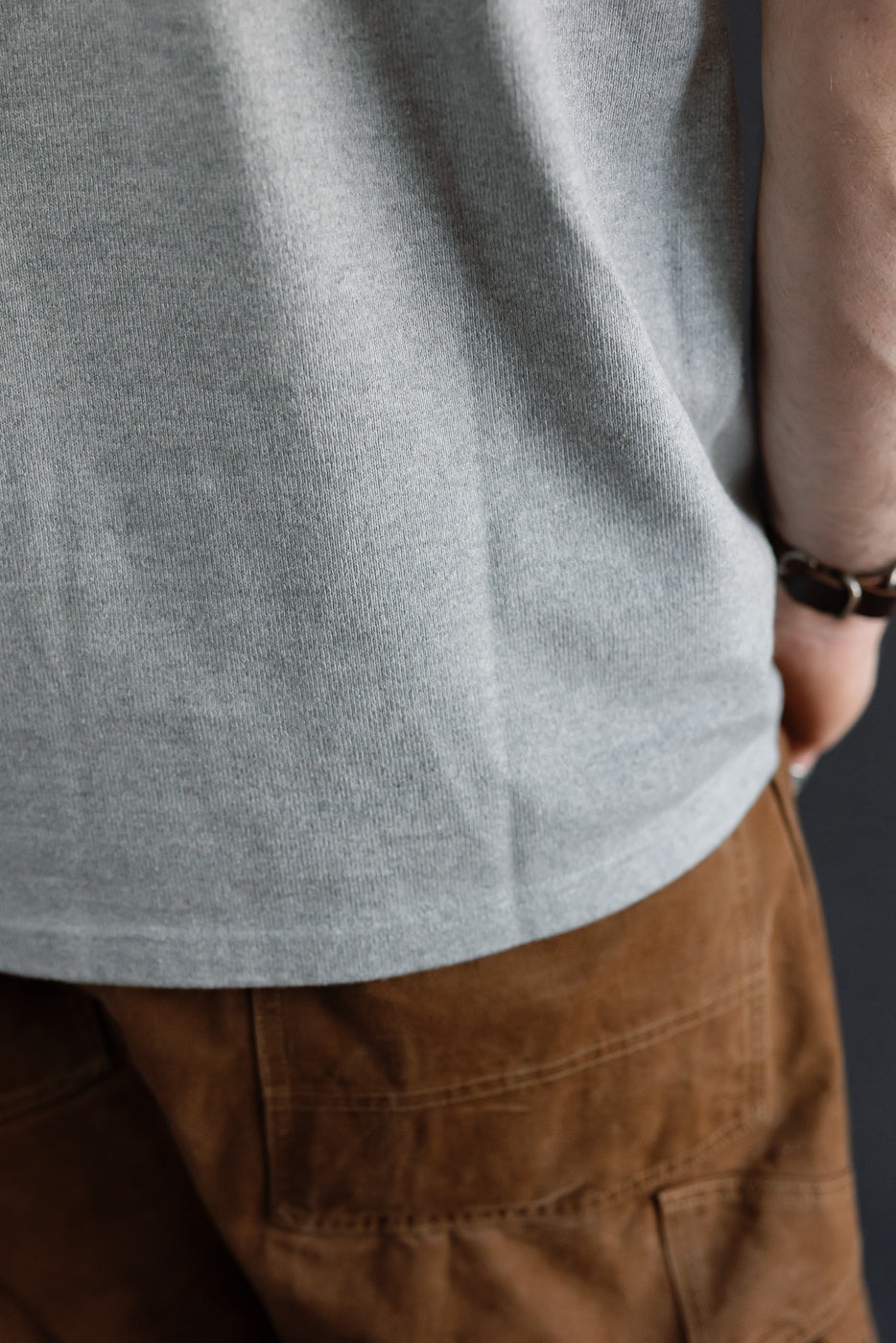 Close-up side view of a male model (5'9