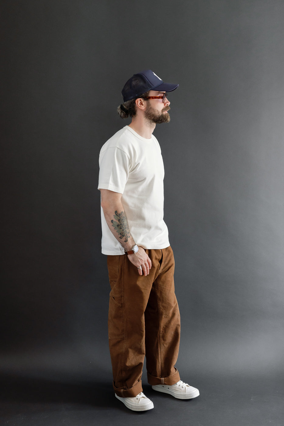 Full body side view of a male model, 5'9