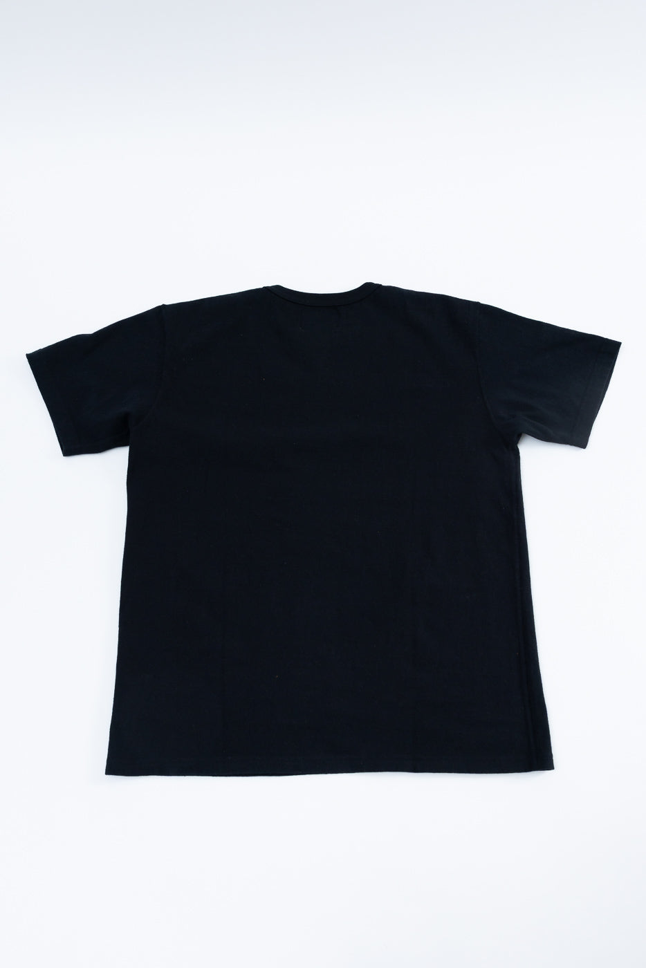 ELS Recycled Cotton Slub Crewneck T-Shirt - Black, showcasing its back with a crew neck and short sleeves, laid flat on a white background, highlighting its modern athletic fit and Japanese craftsmanship.