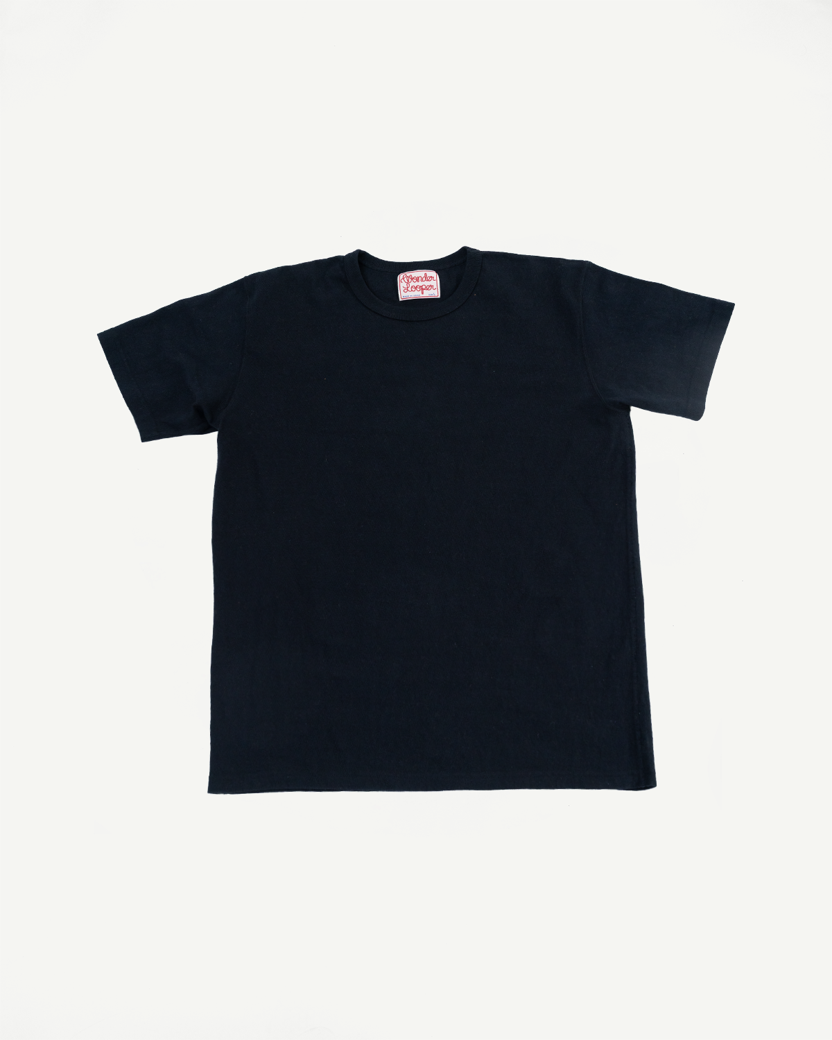 ELS Recycled Cotton Slub Crewneck T-Shirt - Black, displayed flat, features a minimalist design with a small red and white neck label, highlighting its dense texture and modern athletic fit.