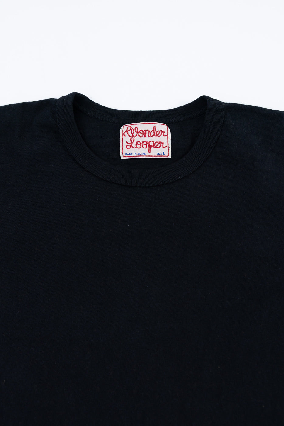 ELS Recycled Cotton Slub Crewneck T-Shirt - Black, featuring a woven label reading “Wonder Looper” with “Made in Japan” and “Size L” beneath, laid flat against a white background.