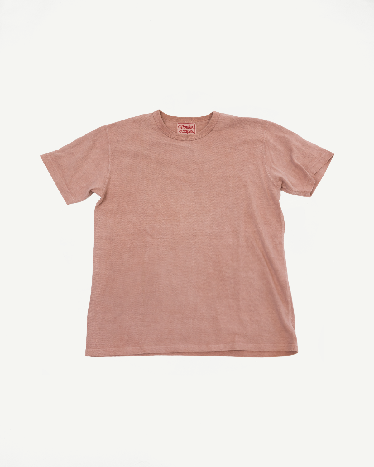 Front flat lay of dusty rose short-sleeve tee with ribbed texture and brand tag at collar