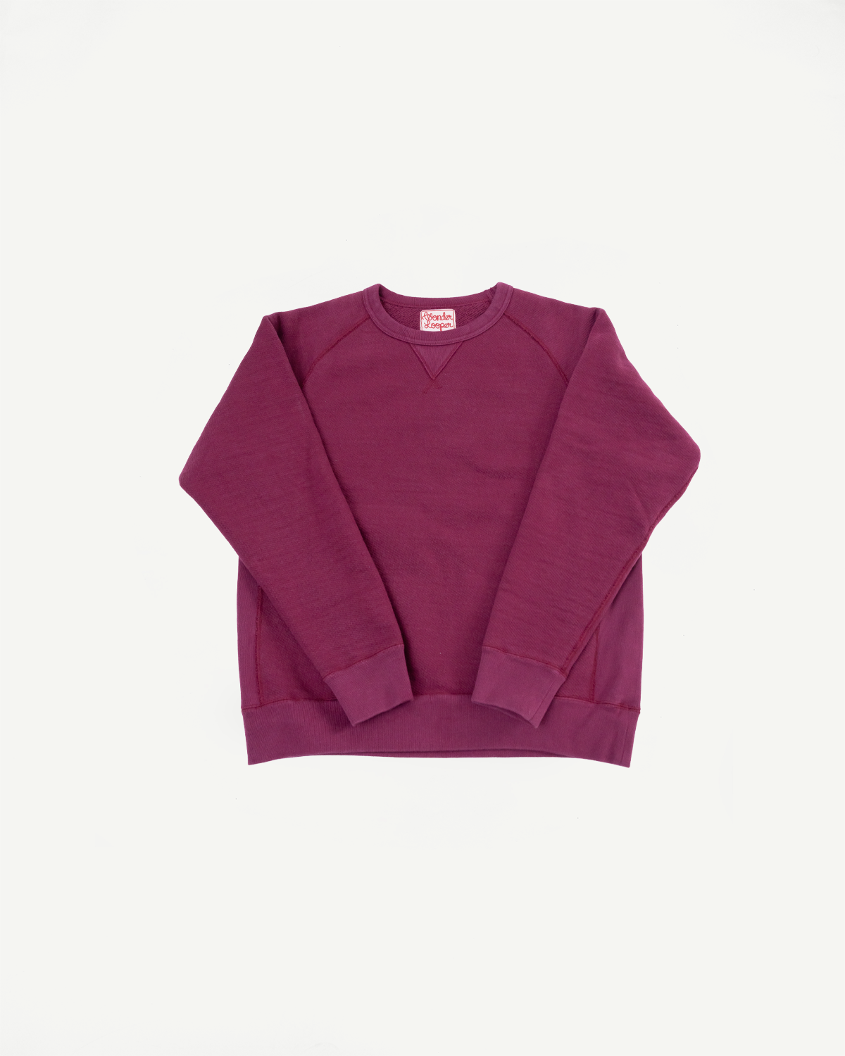 Front view flat lay of a maroon crewneck sweatshirt with a raglan sleeve design.