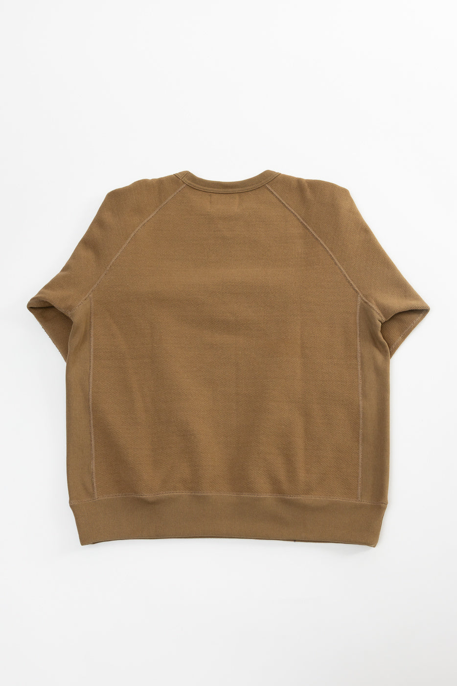 Flat lay of Wonder Looper pullover crewneck in dune, back view, showing heavyweight French terry fabric and raglan sleeve details.
