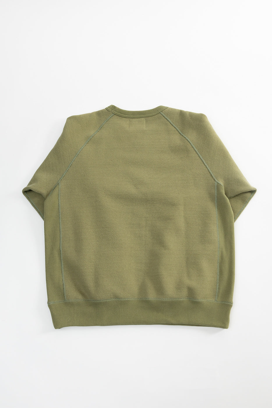Sage green Wonder Looper pullover crewneck, flat lay, showing back, French terry, ribbed hem.