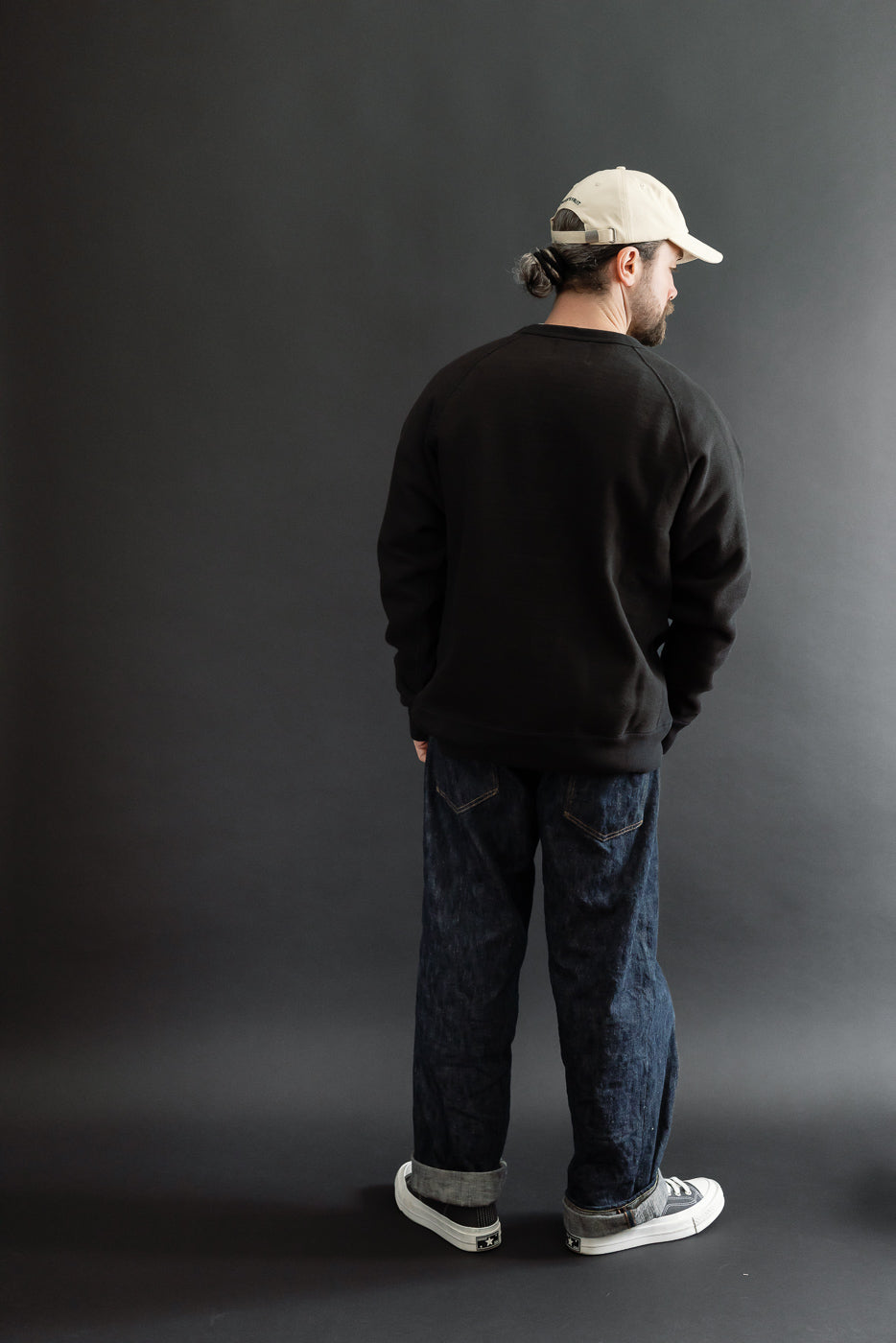 Full body back view of a male model (5'9