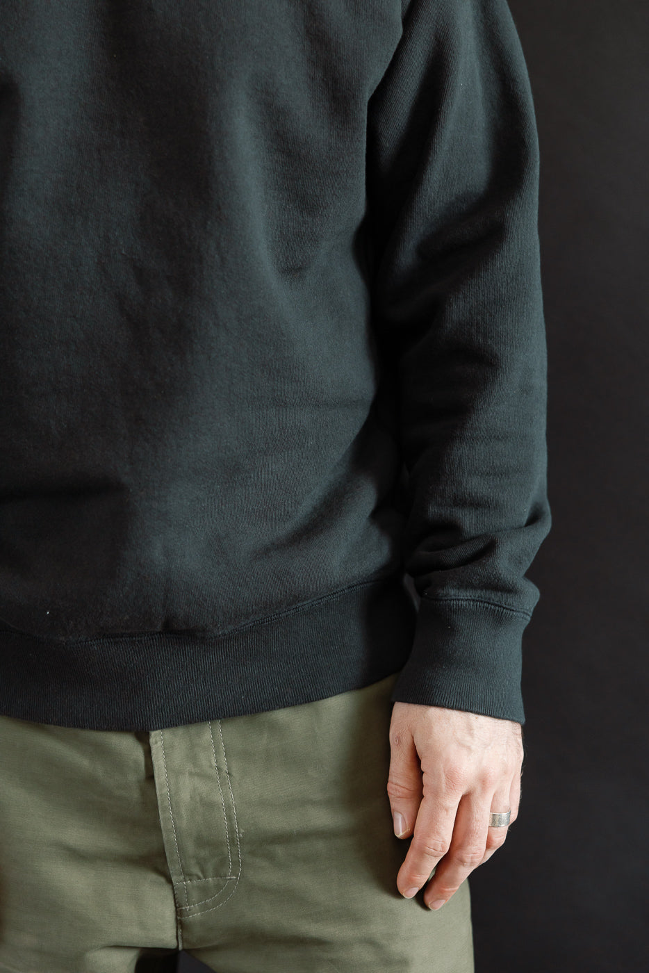 Pullover Crewneck - Super Looper French Terry - Sumi, showcasing the unique texture of the Tsuriami knit fabric, worn with olive-green pants, highlighting the sweatshirt's modern athletic fit and raglan sleeve construction.