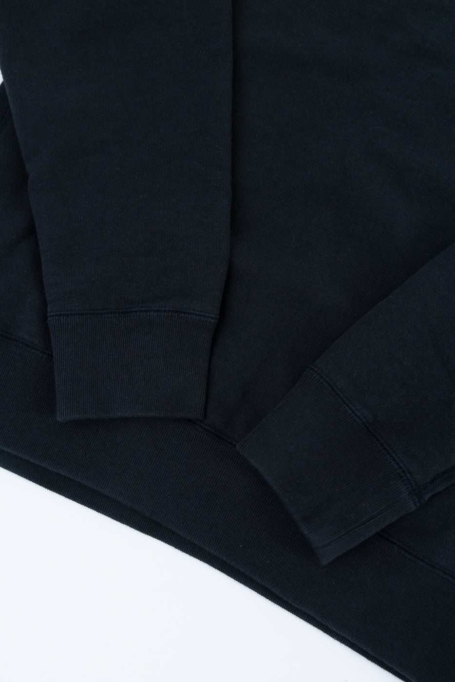 Pullover Crewneck - Super Looper French Terry - Sumi features ribbed cuffs, hem, and side panels, showcasing its rich texture and craftsmanship with clean lines and a smooth sweatshirt-style exterior.