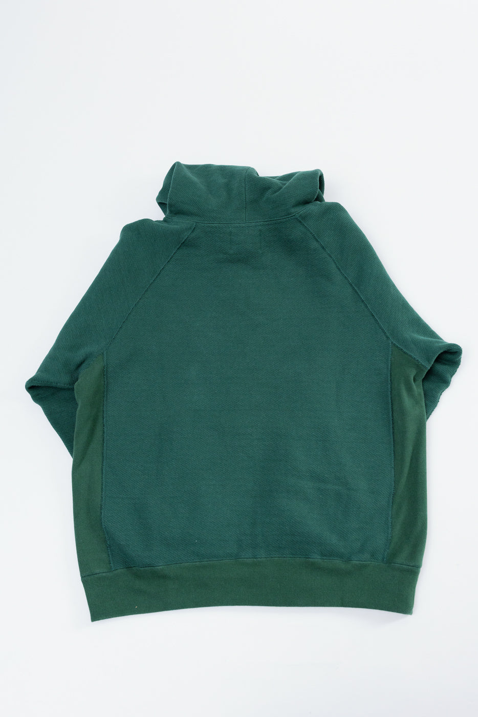 Back view flat lay of a forest green hooded sweatshirt with raglan sleeves and ribbed hem.
