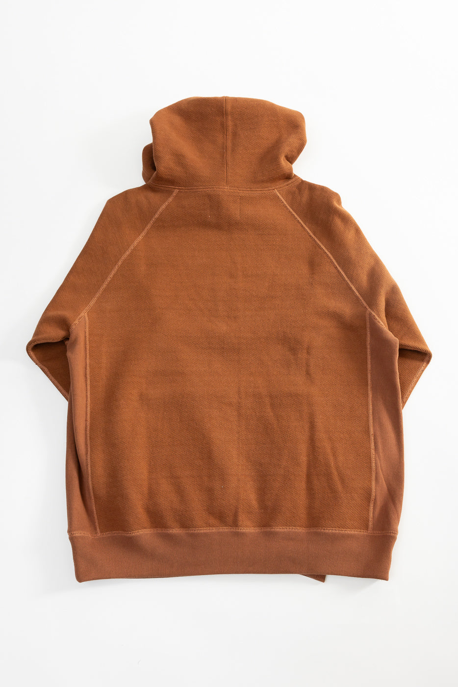 Flat lay of rust Wonder Looper pullover hoodie, back view, heavyweight French terry.