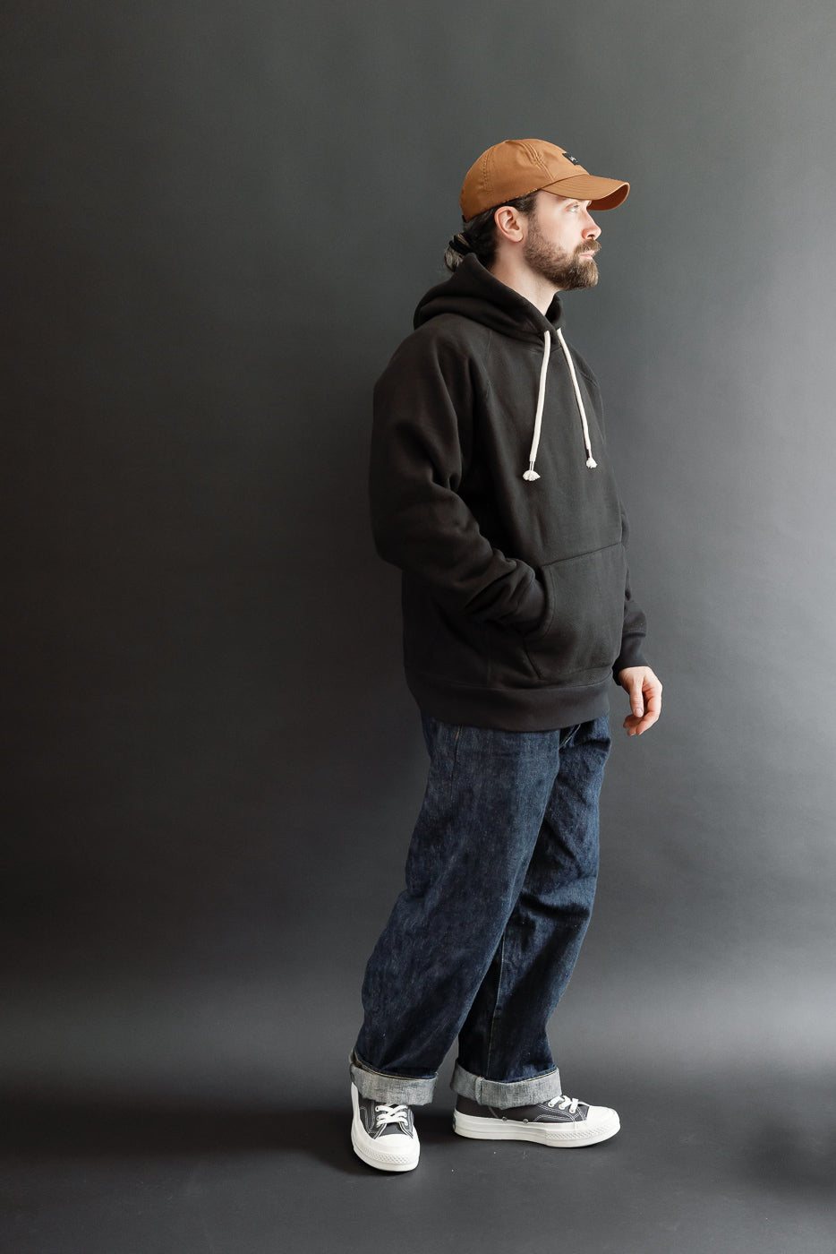 Full body side view of a male model, 5'9