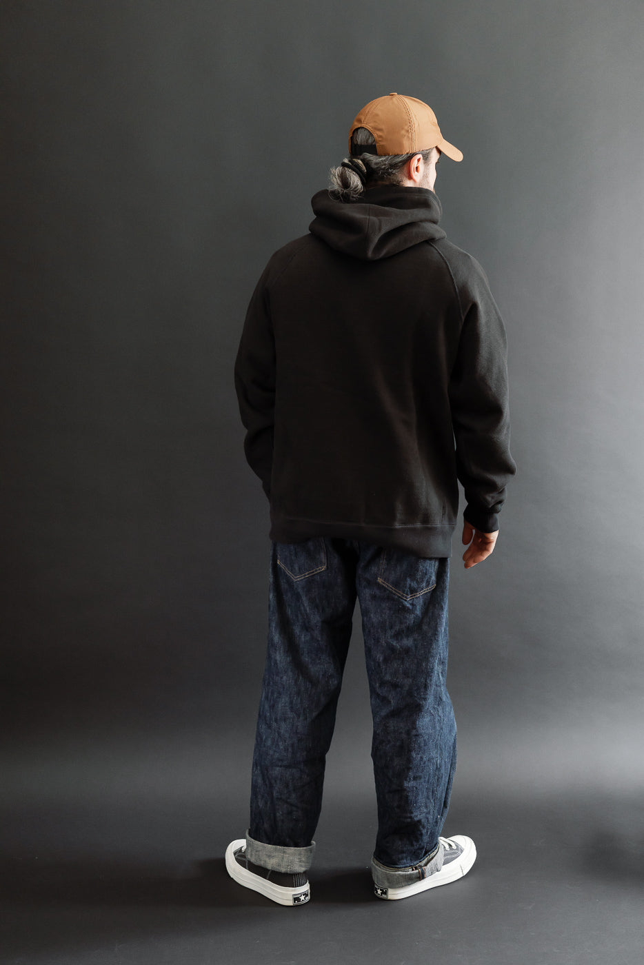 Back view, full body of a male model (5'9