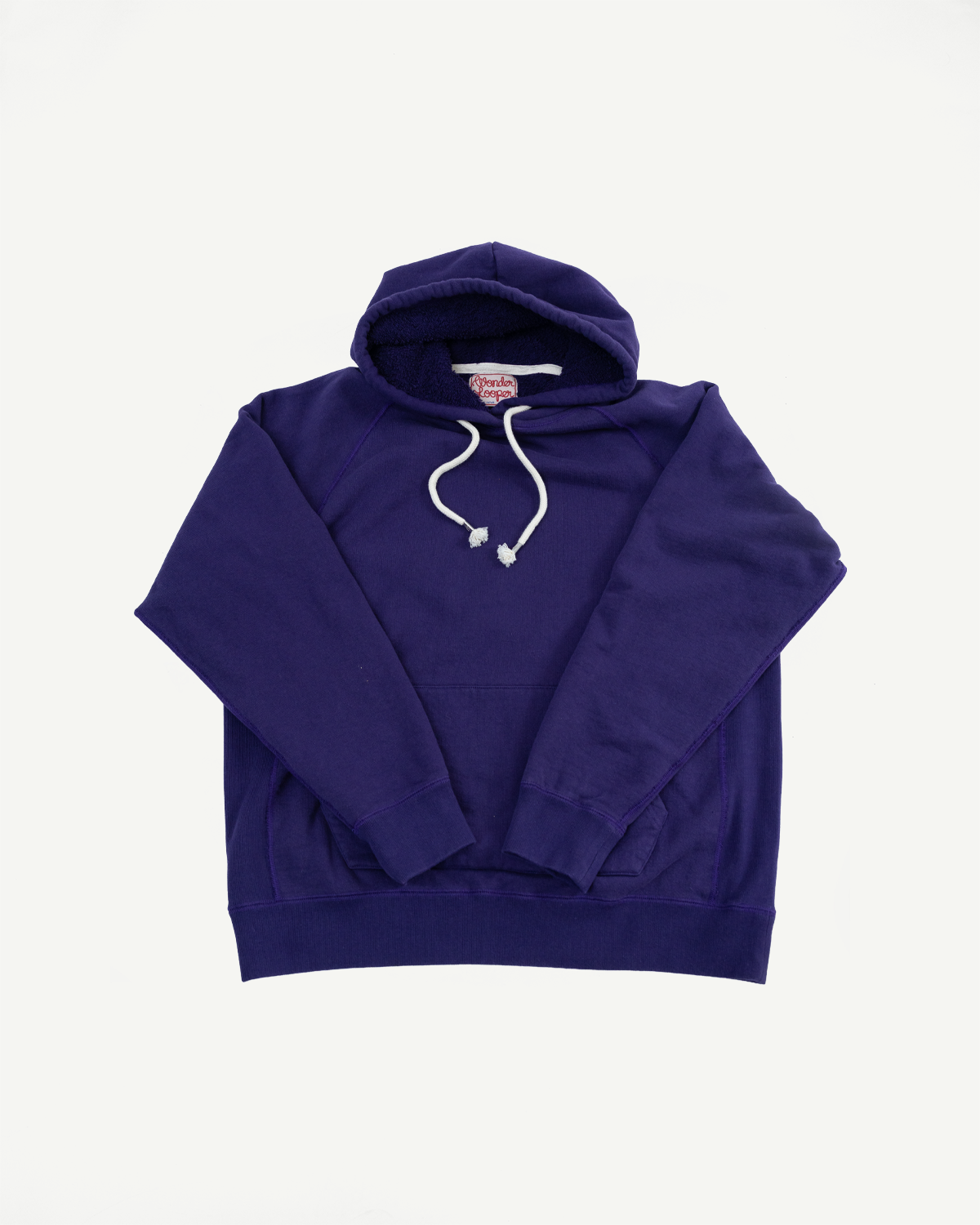 Pullover Hoodie - Super Looper French Terry - Purple, showcasing a deep-purple hooded sweatshirt with raglan sleeves, a kangaroo pocket, and a fleece-lined hood, laid flat on a white background.