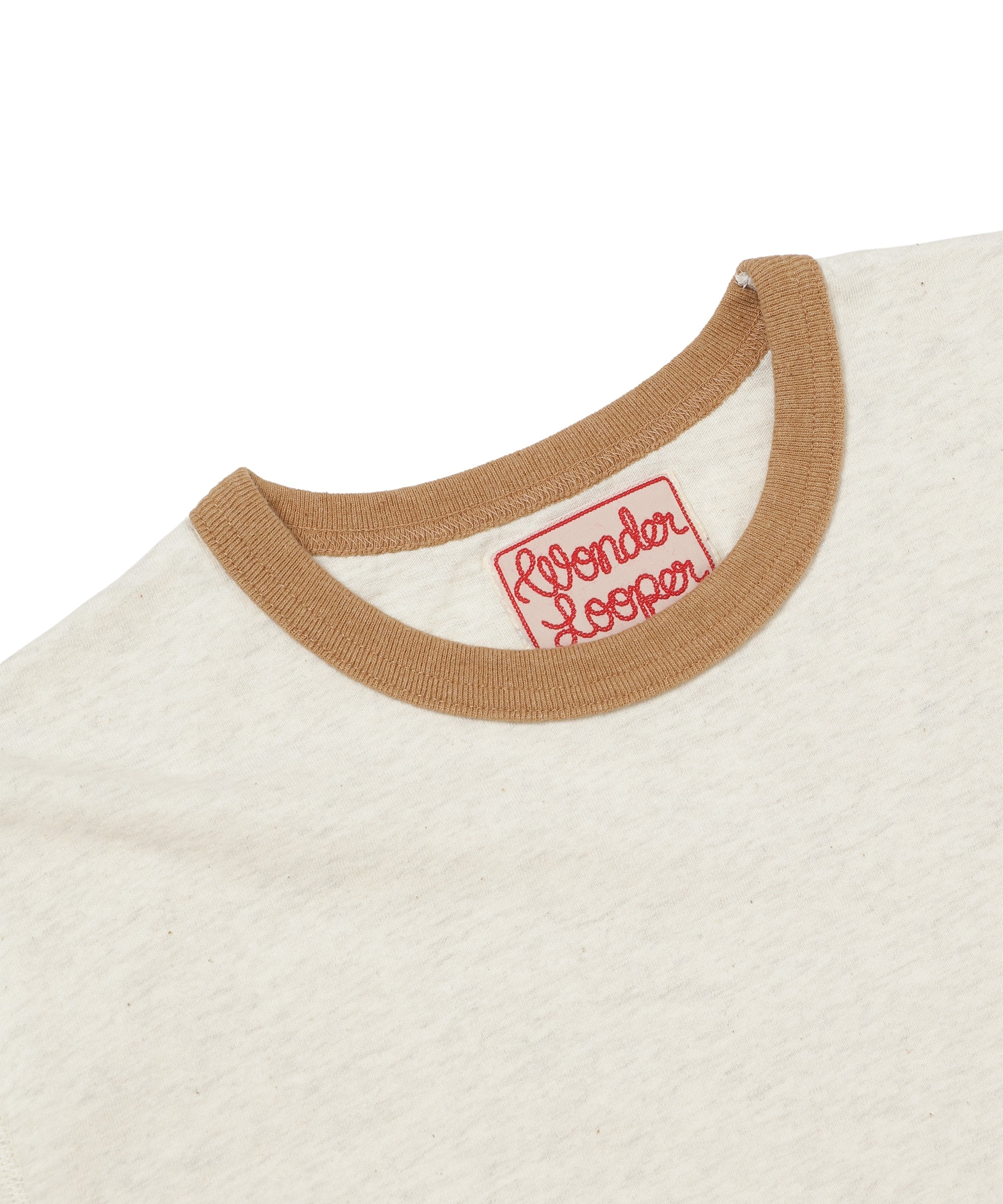 Close-up of front collar and neck tag on sand recycled cotton ringer t-shirt, showing ribbed brown collar and Wonder Looper label.