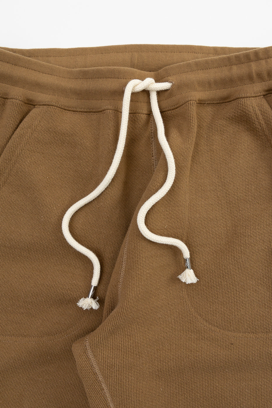 Close-up front view of Dant Wonder Looper sweatpant in dune, heavy French terry fabric, drawstring waist detail.