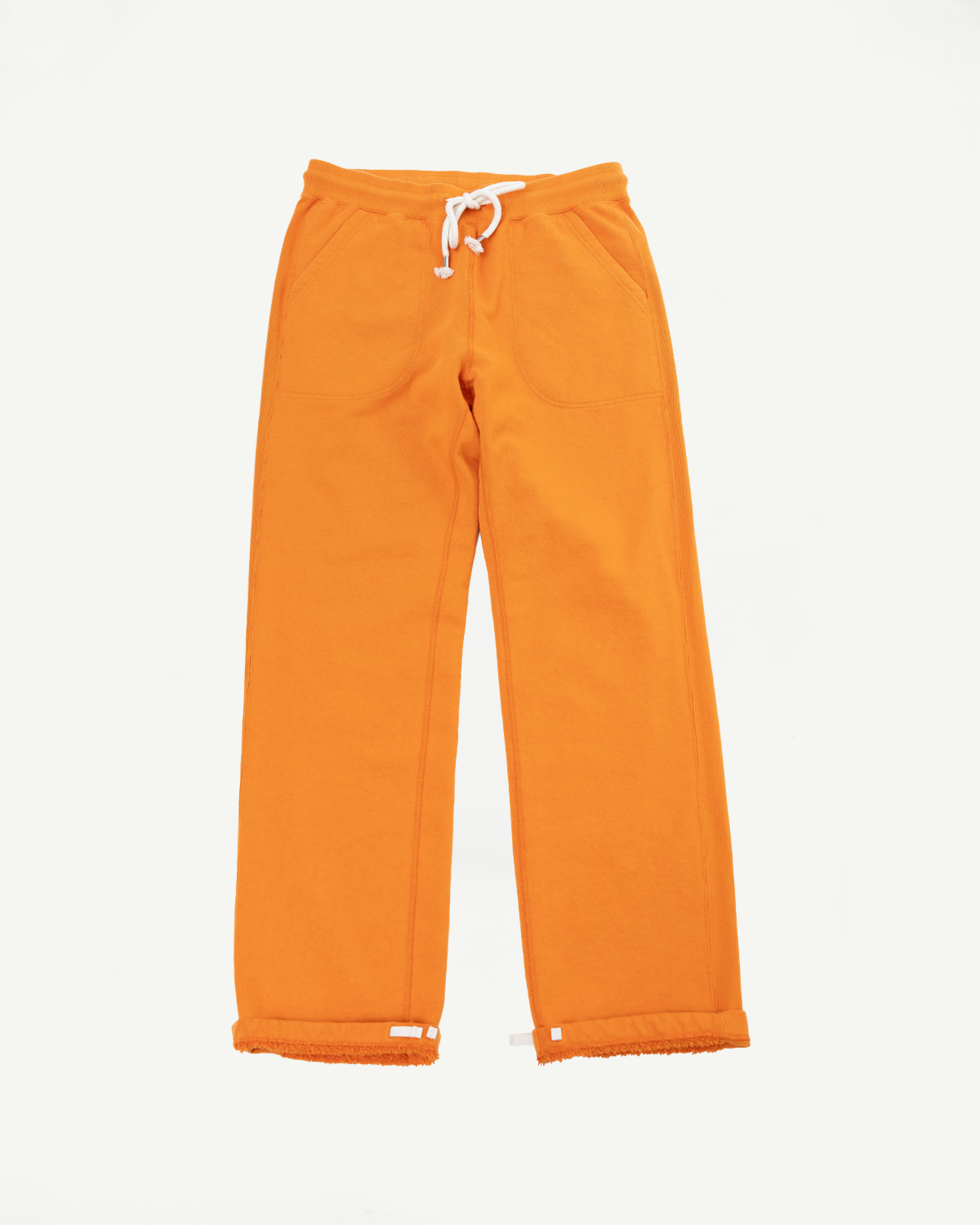 Flat lay front view of orange wide-leg sweatpants with white drawstring, side pockets, and cuffed hems.