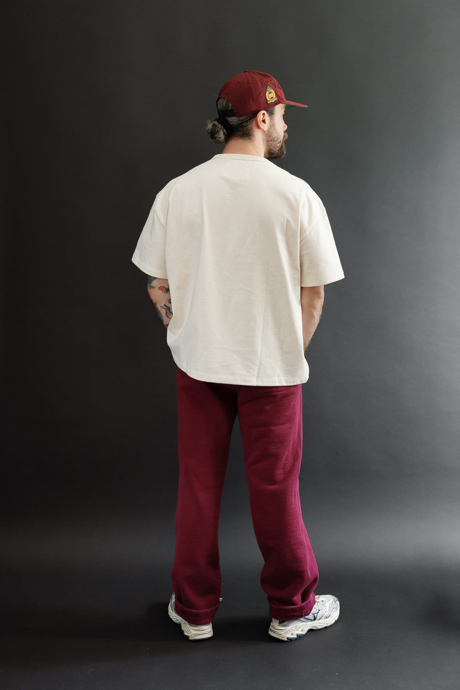 Back view, full body of a male model (5'9