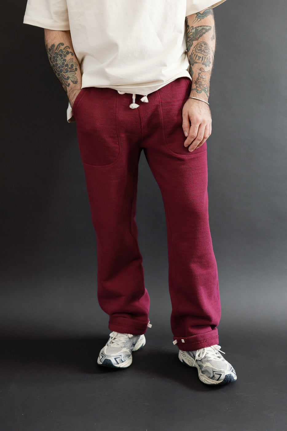 Full body front view of a male model, 5'9