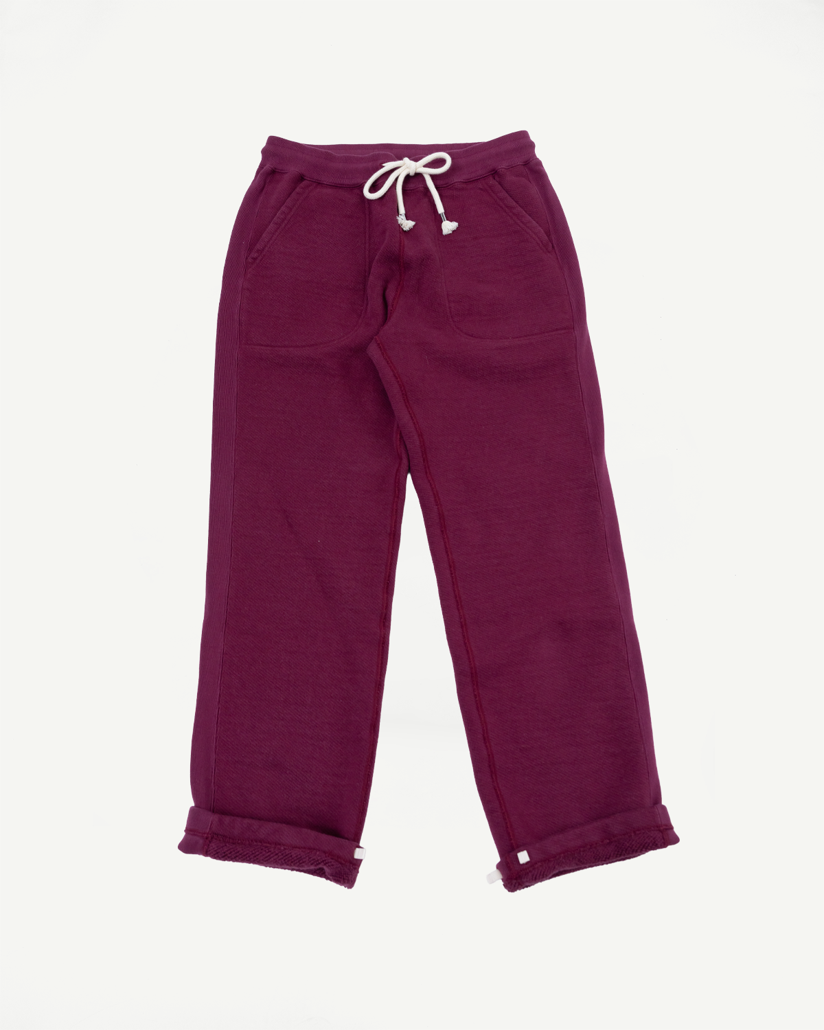 Front full view flat lay of burgundy sweatpants with a drawstring waist and rolled hems.