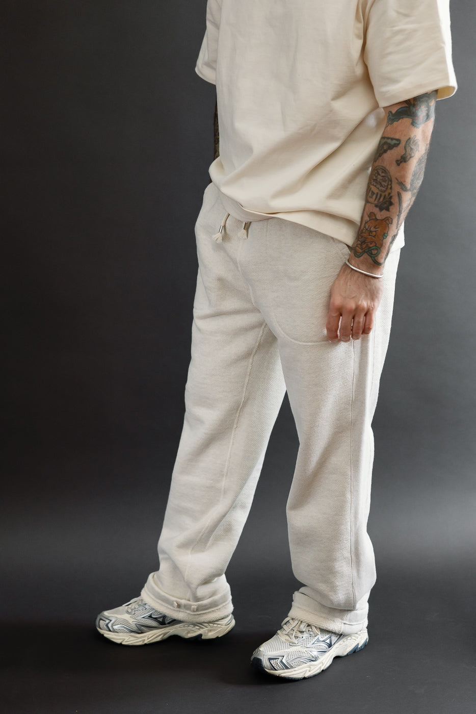Full body side view of a male model, 5'9