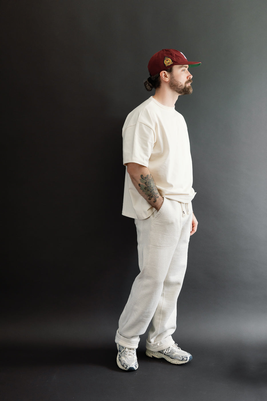 Full body side view of a male model, 5'9