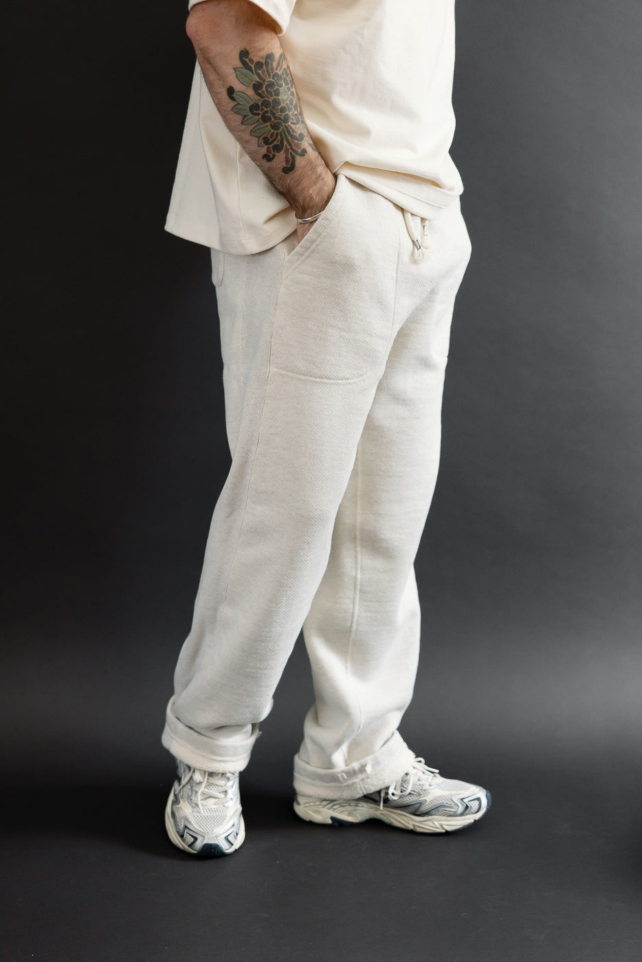 Full body side view of a male model, 5'9