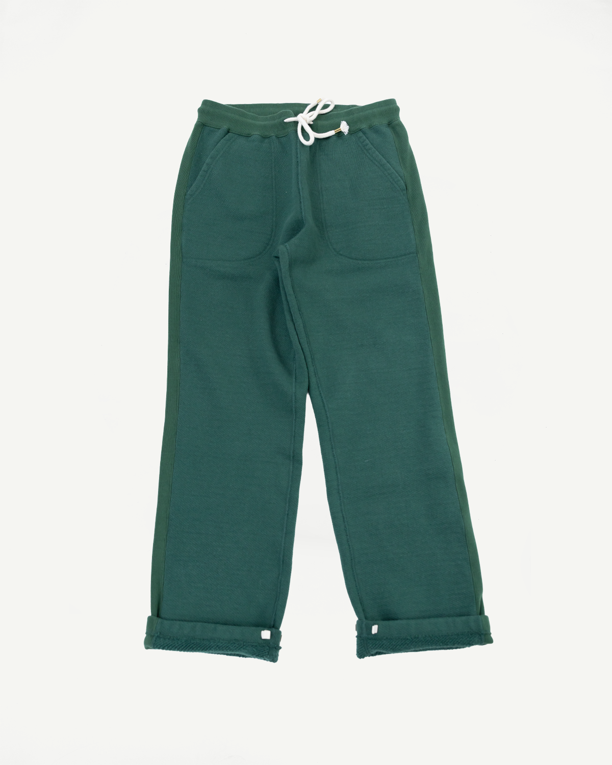 Front view flat lay of dark green cotton sweatpants with drawstring waist and rolled hems.