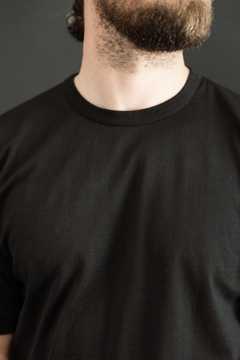 Ultimate Pima Tsuriami Crewneck T-Shirt - Black, showcased on a model highlighting its smooth texture and athletic fit, crafted from 100% organic Pima cotton, known for its exceptional softness and durability.